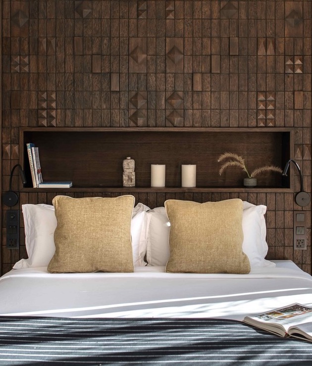Garden Suite bed with hand-carved wood panel